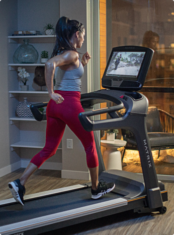 
                        
                         Woman running on a treadmill in a home setting
                        
                        